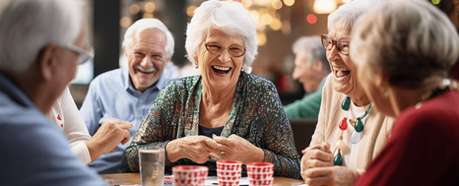 6 seniors at a table plating card games