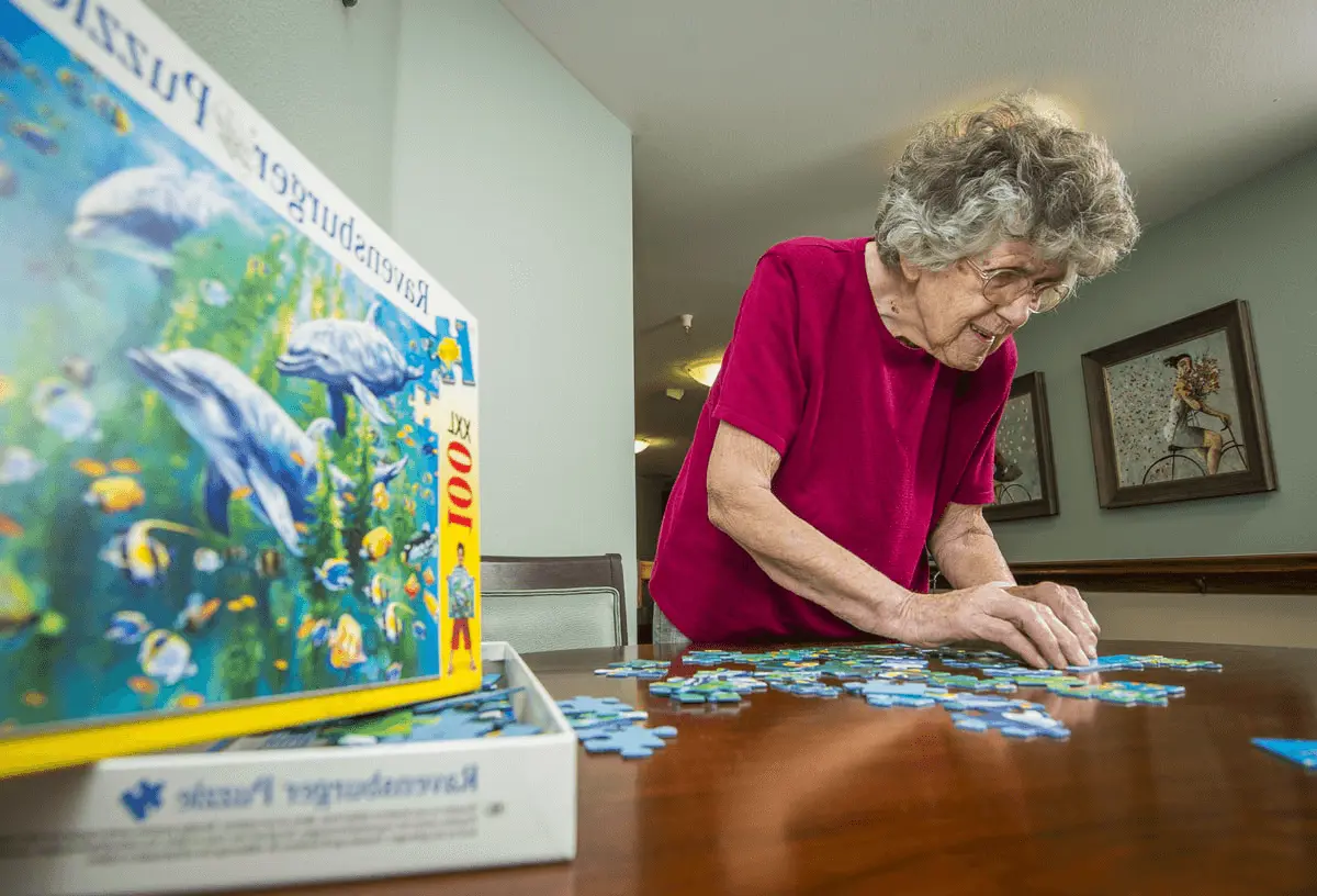 Ontario senior living member doing a puzzle